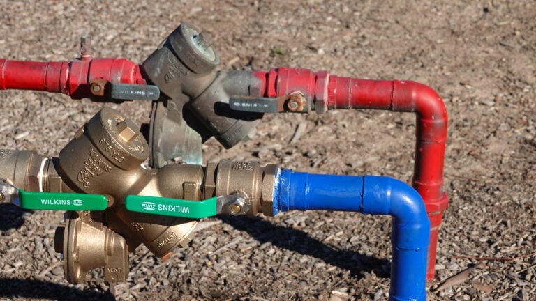 Waterlines with backflow prevention device